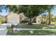 Charming home featuring a lush front yard with mature tree, and a two-car garage at 1914 Elk Spring Dr, Brandon, FL 33511