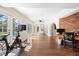 Hallway with lots of natural light, French doors, and wood floors at 1914 Elk Spring Dr, Brandon, FL 33511
