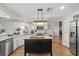 Well-lit kitchen with a center island, stainless steel appliances, and granite countertops at 1914 Elk Spring Dr, Brandon, FL 33511