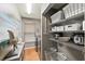 Well-organized laundry room with shelving and tile flooring providing ample storage space and convenience at 1914 Elk Spring Dr, Brandon, FL 33511