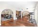 Spacious open-concept living area with hardwood floors connecting different living spaces at 1914 Elk Spring Dr, Brandon, FL 33511