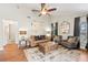 Cozy living room featuring hardwood floors, neutral tones, and ample natural light at 1914 Elk Spring Dr, Brandon, FL 33511