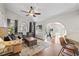 Open-concept living room with hardwood floors, neutral decor, and easy access to the exercise room at 1914 Elk Spring Dr, Brandon, FL 33511