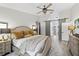 Comfortable main bedroom with wood floors, ceiling fan, and barn doors at 1914 Elk Spring Dr, Brandon, FL 33511