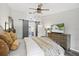 Bedroom with wood-look floors, neutral walls, and large dresser at 1914 Elk Spring Dr, Brandon, FL 33511