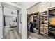 Well-organized walk-in closet featuring built-in shelving for shoes and clothing at 1914 Elk Spring Dr, Brandon, FL 33511