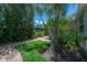 A charming backyard brick paver path leads through the lush garden, providing a peaceful retreat at 204 E North St, Tampa, FL 33604