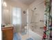 Clean bathroom featuring a shower-tub combo and a modern vanity at 204 E North St, Tampa, FL 33604