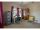 Well-lit bedroom with a desk, chair, and vintage cabinet, perfect for a study at 204 E North St, Tampa, FL 33604