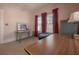 Bright bedroom featuring a desk, chair, and vintage cabinet with plenty of natural light at 204 E North St, Tampa, FL 33604