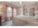 Comfortable bedroom with pink walls, patterned quilt, and plenty of natural light at 204 E North St, Tampa, FL 33604
