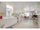 Bright and airy kitchen with white cabinets and ample counter space, adjacent to dining area at 204 E North St, Tampa, FL 33604