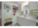 Bright kitchen space featuring white cabinets, stainless steel sink and window at 204 E North St, Tampa, FL 33604