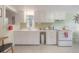 Functional kitchen with white cabinetry, updated appliances, and a vintage charm at 204 E North St, Tampa, FL 33604