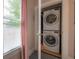 Efficient laundry closet with stacked washer and dryer near a window at 204 E North St, Tampa, FL 33604