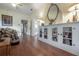 Open living area with hardwood floors, built-in cabinets, and views into adjoining rooms at 204 E North St, Tampa, FL 33604