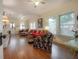 Bright living room with hardwood floors, ceiling fan, and lots of natural light at 204 E North St, Tampa, FL 33604