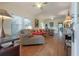 Bright living room with hardwood floors, large windows, and vintage furniture at 204 E North St, Tampa, FL 33604