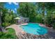 Inviting pool area surrounded by lush landscaping, ideal for outdoor enjoyment and relaxation at 204 E North St, Tampa, FL 33604