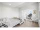 Light filled bedroom has hardwood floors and sliding panel doors that lead to an office space at 205 5Th N Ave # 501, St Petersburg, FL 33701