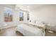 Bright bedroom with large windows offering city views and a comfortable bed with a floral accent blanket at 205 5Th N Ave # 501, St Petersburg, FL 33701