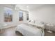 Bright bedroom featuring hardwood floors, two large windows, and modern furniture at 205 5Th N Ave # 501, St Petersburg, FL 33701