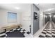 Well-lit hallway featuring black and white checkered tile flooring and a cozy bench with mailboxes at 205 5Th N Ave # 501, St Petersburg, FL 33701