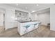 Modern kitchen with a large island, seating, stainless steel appliances, and sleek white cabinets at 205 5Th N Ave # 501, St Petersburg, FL 33701