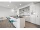 Modern kitchen featuring white cabinets, a black countertop island, and stainless steel appliances at 205 5Th N Ave # 501, St Petersburg, FL 33701