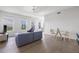 Bright and airy living room featuring hardwood floors and large windows with city views at 205 5Th N Ave # 501, St Petersburg, FL 33701