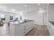 Spacious, open-concept living area with sleek island, bright lighting, and a view of the city at 205 5Th N Ave # 501, St Petersburg, FL 33701