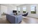 Comfortable living room with ample seating, hardwood floors, and natural light from large windows at 205 5Th N Ave # 501, St Petersburg, FL 33701