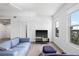 Bright living room features hardwood floors, a modern sofa, and sliding doors leading to other living spaces at 205 5Th N Ave # 501, St Petersburg, FL 33701