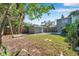 Expansive backyard with a patio dining area, providing a serene outdoor retreat and ample green space at 2078 Madrid N Ct, Clearwater, FL 33763