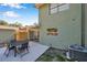 Backyard patio perfect for outdoor gatherings, showcasing access to both the home and lush outdoor space at 2078 Madrid N Ct, Clearwater, FL 33763