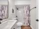 Updated bathroom featuring a stylish vanity with marble countertop, and tub with subway tile surround at 2078 Madrid N Ct, Clearwater, FL 33763