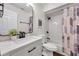 Updated bathroom featuring a stylish vanity, modern fixtures, and tub with subway tile surround at 2078 Madrid N Ct, Clearwater, FL 33763