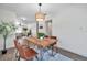 Open dining area features stylish chairs, modern lighting, and an open floor plan at 2078 Madrid N Ct, Clearwater, FL 33763