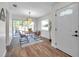 Bright dining room featuring hardwood floors, modern table and chairs, and natural light at 2078 Madrid N Ct, Clearwater, FL 33763