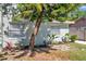 Charming home exterior with a beautifully landscaped front yard, healthy plants, and mature trees at 2078 Madrid N Ct, Clearwater, FL 33763