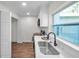 Modern kitchen featuring quartz countertops, subway tile backsplash, and stainless sink at 2078 Madrid N Ct, Clearwater, FL 33763