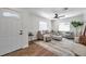 Bright living room with stylish furniture, a ceiling fan, and natural light at 2078 Madrid N Ct, Clearwater, FL 33763