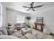 Bright living room featuring stylish furniture and wood-look flooring at 2078 Madrid N Ct, Clearwater, FL 33763