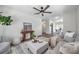 Spacious living area with modern decor and an open floor plan leading to the dining area at 2078 Madrid N Ct, Clearwater, FL 33763