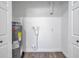 A peek inside the utility room, featuring a water heater, storage space, and a clean, functional design at 2078 Madrid N Ct, Clearwater, FL 33763