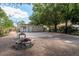 Large brick patio and firepit in a private, tree-filled backyard at 2104 E Navajo Ave, Tampa, FL 33612