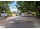 Backyard featuring brick patio and mature shady trees at 2104 E Navajo Ave, Tampa, FL 33612