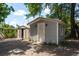 Backyard featuring storage sheds and mature landscaping at 2104 E Navajo Ave, Tampa, FL 33612