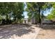 Spacious backyard featuring two sheds, a patio and shade trees at 2104 E Navajo Ave, Tampa, FL 33612