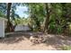 Fenced in backyard with fire pit perfect for entertaining outdoors at 2104 E Navajo Ave, Tampa, FL 33612